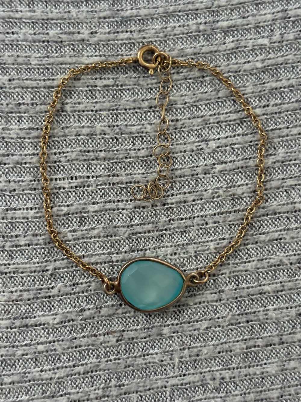 Bohemian theme gold tone adjustable chain bracelet w center frosty blue stone